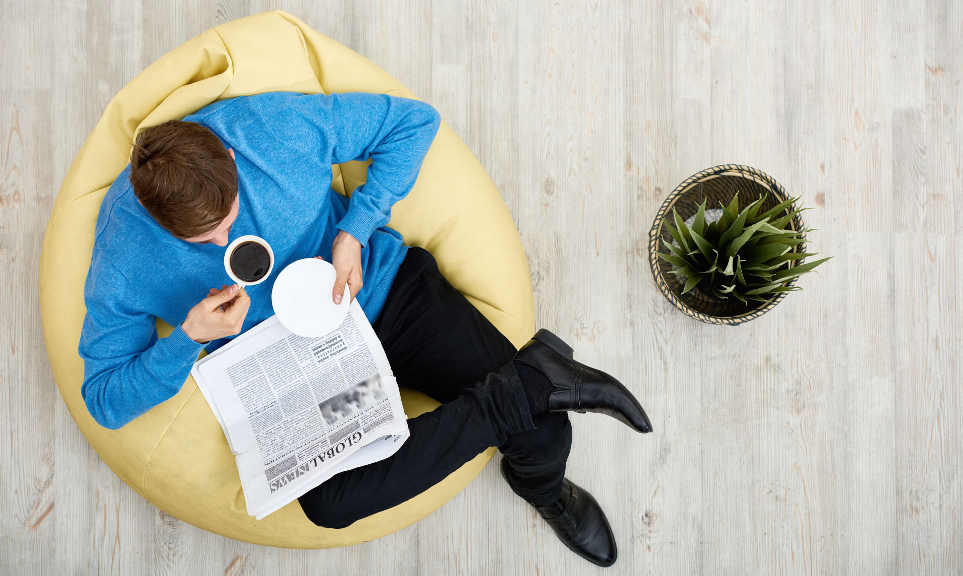 Cruise Scoop - Person sitting in chair reading paper